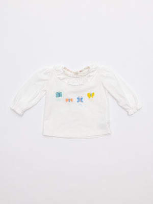 Camiseta cuello volante mariposas piping Liberty nata