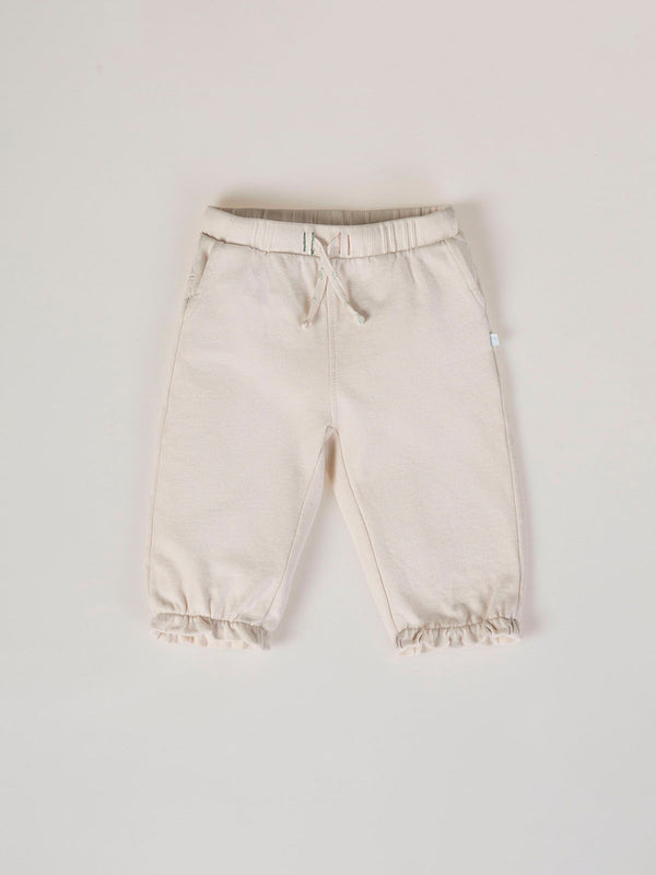 PLUSH PANTS WITH BEIGE RUFFLES AND ELASTIC PANTS
