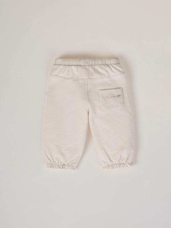 PLUSH PANTS WITH BEIGE RUFFLES AND ELASTIC PANTS