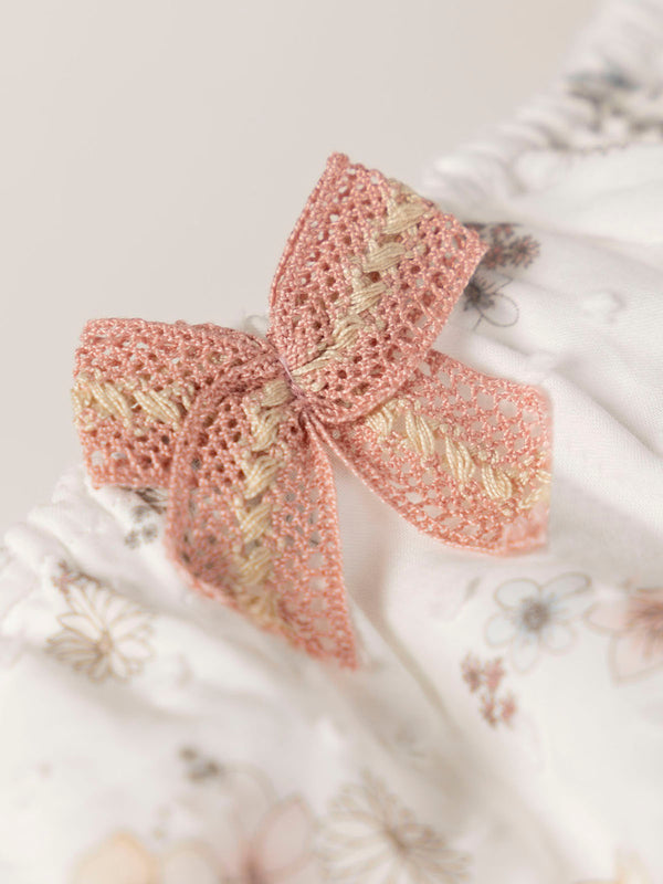 FLOWER PRINTED ROMPER WITH CREAM BOW