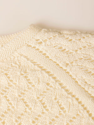 KNITTED JACKET WITH IVORY OPENWORK BUTTON