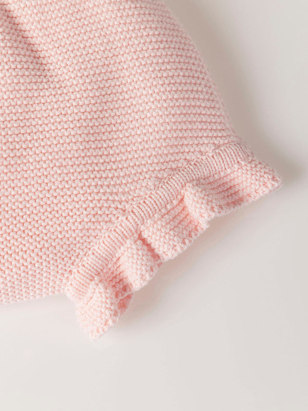 ROMPER WITH KNITTED STRAPS AND RUFFLES WITH PINK LINKS