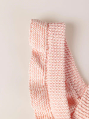 ROMPER WITH KNITTED STRAPS AND RUFFLES WITH PINK LINKS