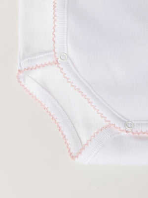 PINK CROSSED LONG SLEEVE BODYSUIT