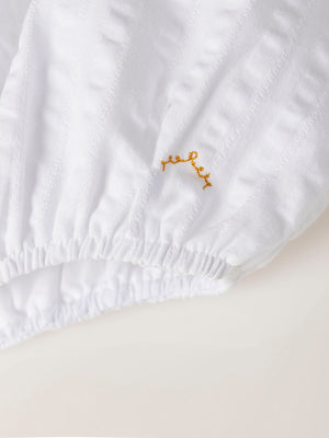 MAMELUCO ESTRUCTURA CUELLO PLUMETI MARFIL