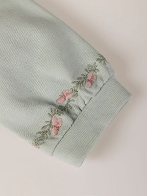 SWEATSHIRT WITH EMBROIDERED FLOWERS AND LIGHT GREEN CUFFS