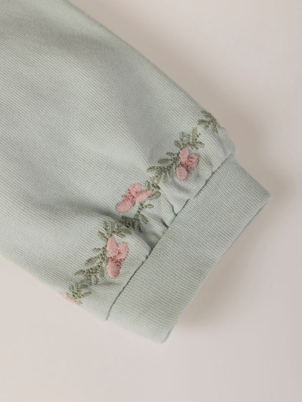 SWEATSHIRT WITH EMBROIDERED FLOWERS AND LIGHT GREEN CUFFS