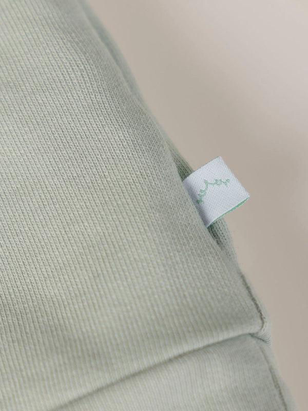 SWEATSHIRT WITH EMBROIDERED FLOWERS AND LIGHT GREEN CUFFS