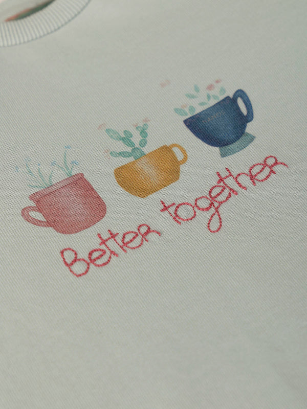 SWEATSHIRT WITH EMBROIDERED FLOWERS AND LIGHT GREEN CUFFS