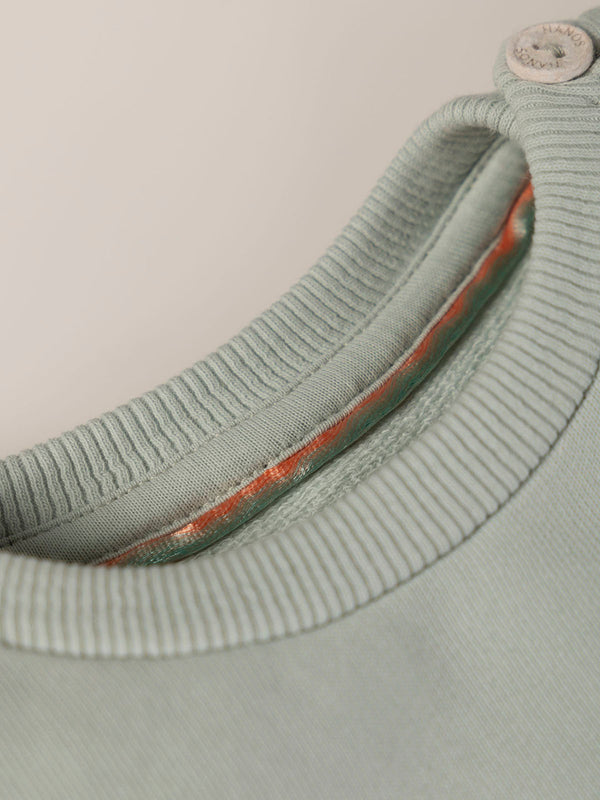 SWEATSHIRT WITH EMBROIDERED FLOWERS AND LIGHT GREEN CUFFS