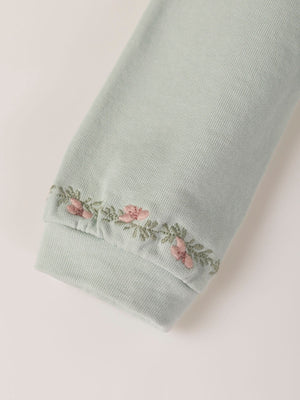 SWEATSHIRT WITH EMBROIDERED FLOWERS AND LIGHT GREEN CUFFS