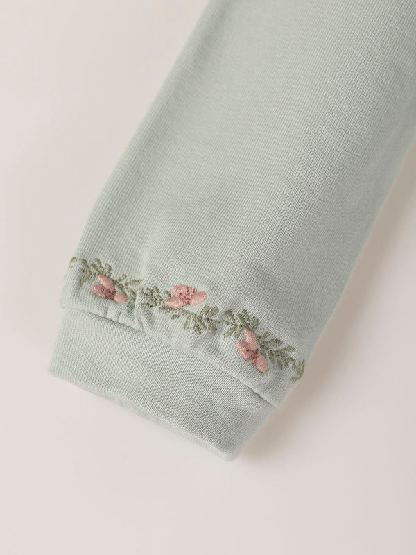 SWEATSHIRT WITH EMBROIDERED FLOWERS AND LIGHT GREEN CUFFS