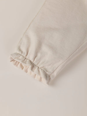 PLUSH PANTS WITH BEIGE RUFFLES AND ELASTIC PANTS