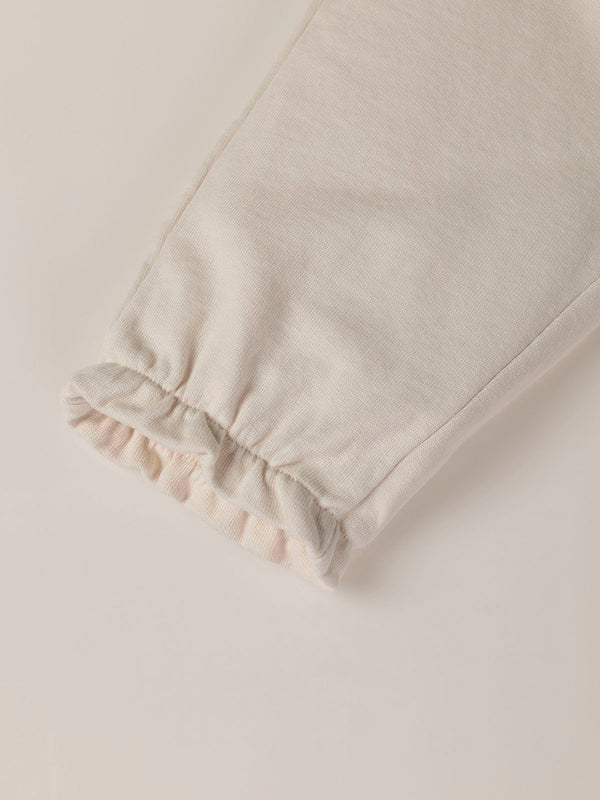 PLUSH PANTS WITH BEIGE RUFFLES AND ELASTIC PANTS