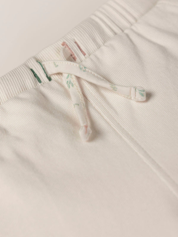 PLUSH PANTS WITH BEIGE RUFFLES AND ELASTIC PANTS