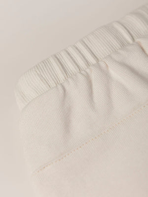 PLUSH PANTS WITH BEIGE RUFFLES AND ELASTIC PANTS