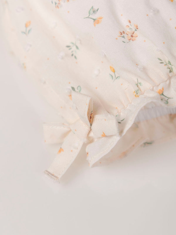 PRINTED PLUMETTI ROMPER WITH OFF-WHITE BOWS