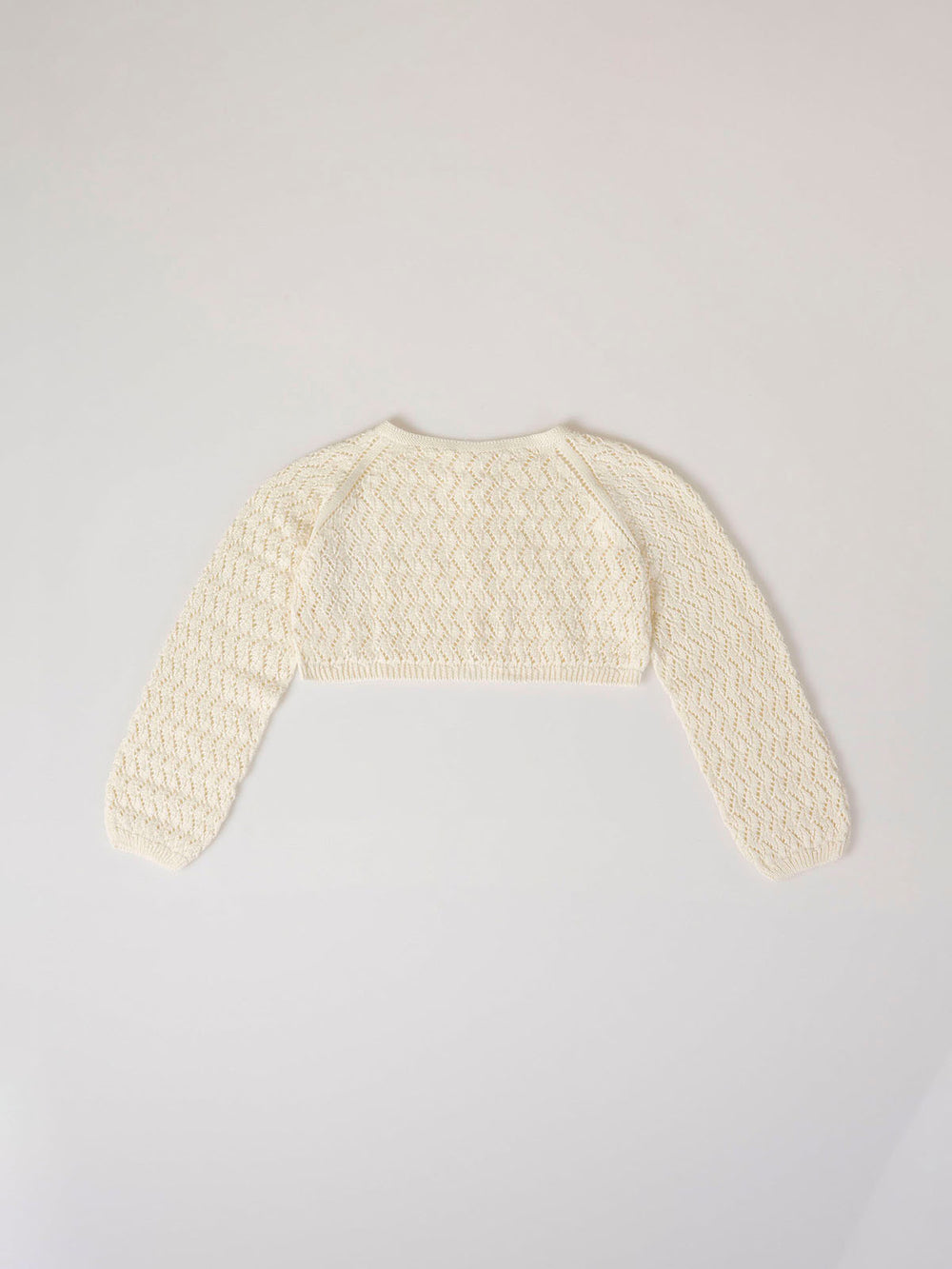 Chaqueta corta punto botón calados marfil