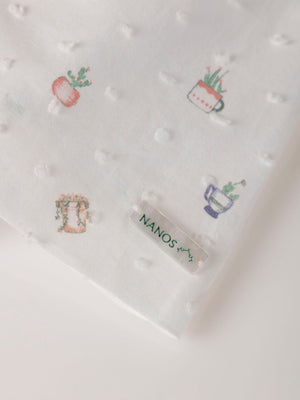 MINI CON BRAGUITA PLUMETI ESTAMPADO MACETA NATA