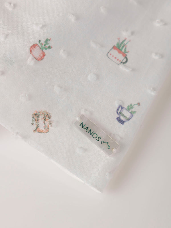MINI CON BRAGUITA PLUMETI ESTAMPADO MACETA NATA